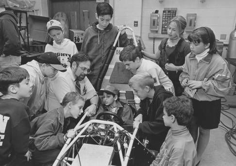 Dr. Cohen with young students.